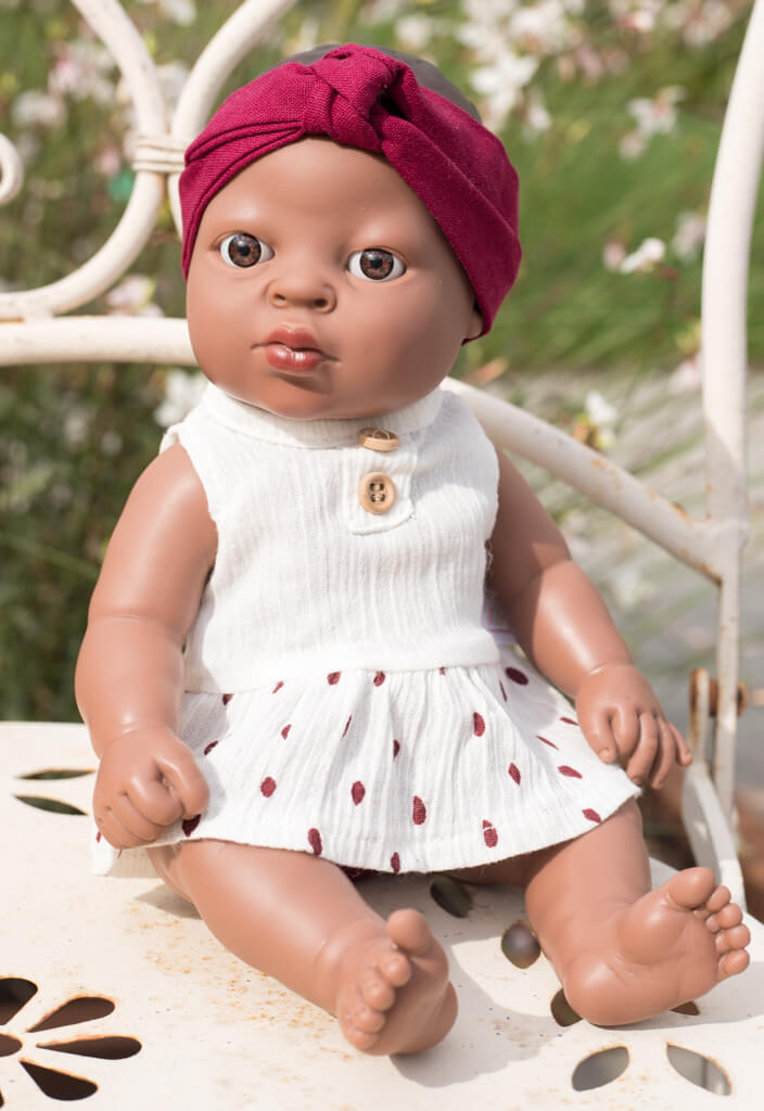 Babypop newborn afrikaans aangekleed met haarband - Speelpop voor meisjes - Berjuan